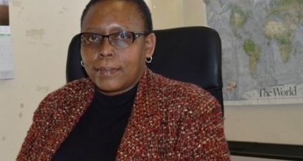 Bohloka Mokhotho sitting at her desk at Habitat Lesotho offices